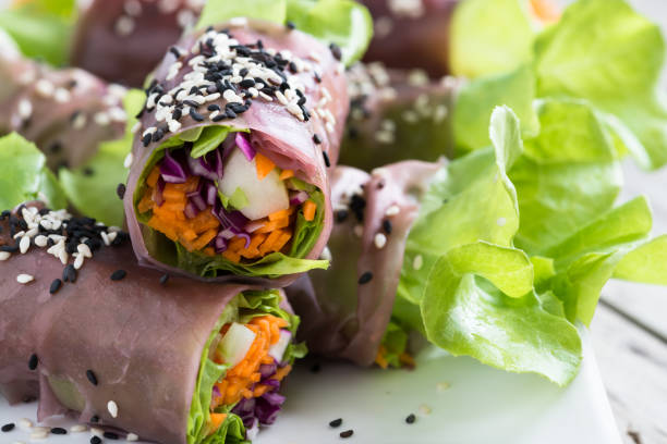 Fresh vegetable noodle spring roll, with butterfly pea flower. Brown rice spring roll paper.