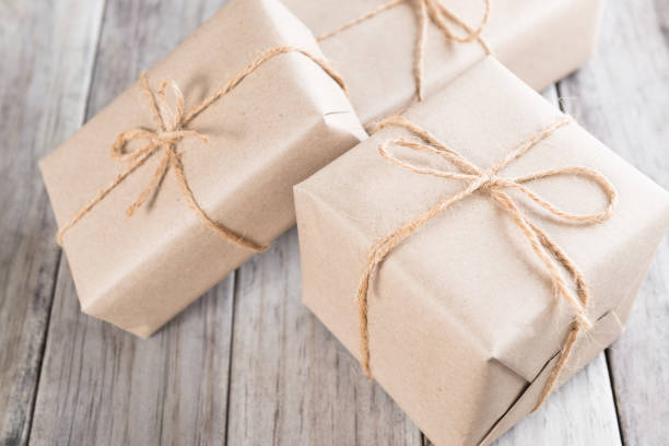 istock Cardboard box on a wooden background, Brown mail package parcel wrap delivery 640910628