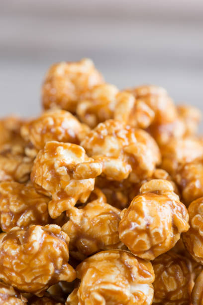 istock Caramel popcorn on wooden background 640910648