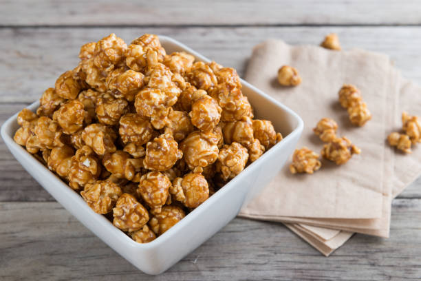 istock Caramel popcorn on wooden background 640911650