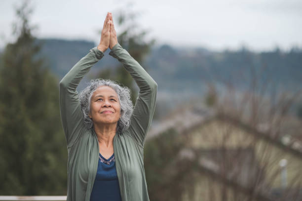 istock Woman doing yoga pose outside 640912126