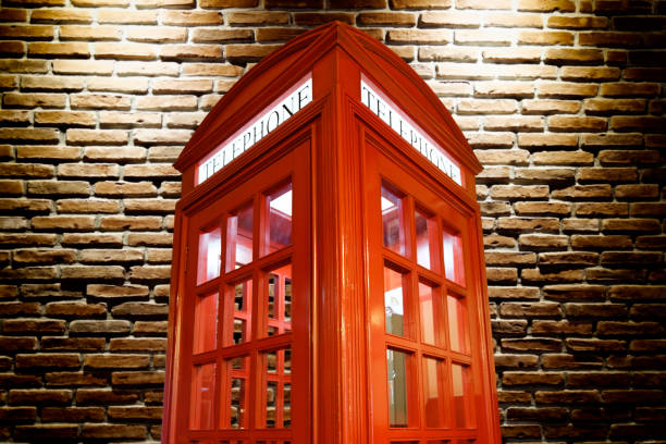 istock Telephone box and brick wall 640921522