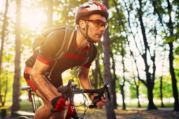 istock Young and energetic cyclist in the park 640921616