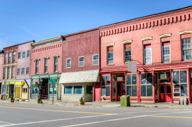 Old Brick Buildings and Colorful Stores Historic Buildings with Colorful Storefronts in a Town Centre. Prattsburg, NY finger lakes stock pictures, royalty-free photos & images