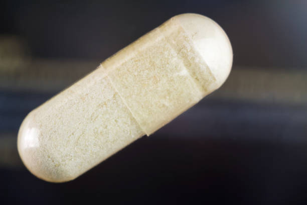 Glucosamine capsules, food supplement pills, top view, macro image