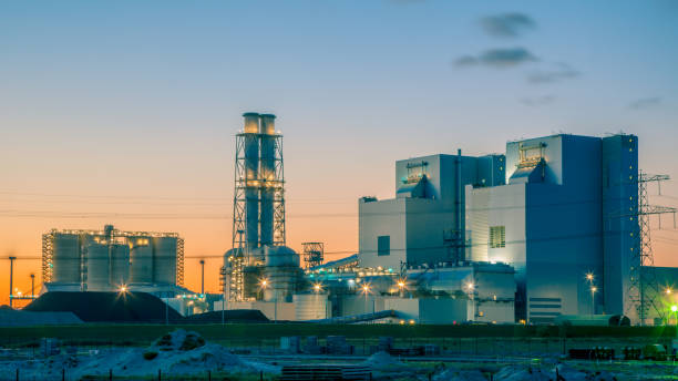 istock Ultra modern coal powered electrical power plant at sunset under a blue and orange sky 640926844