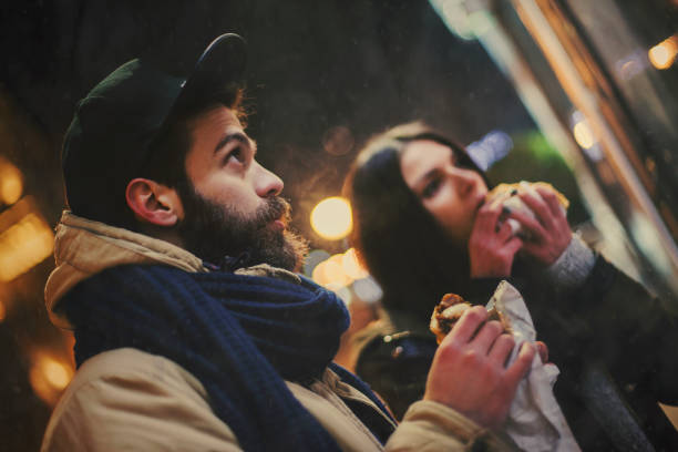 istock Couple eating on the street 640927666