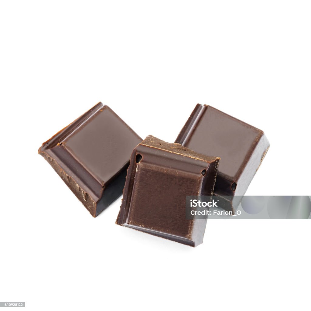 Dark chocolate cubes isolated on white background. Dark chocolate cubes isolated on white background Dark Chocolate Stock Photo