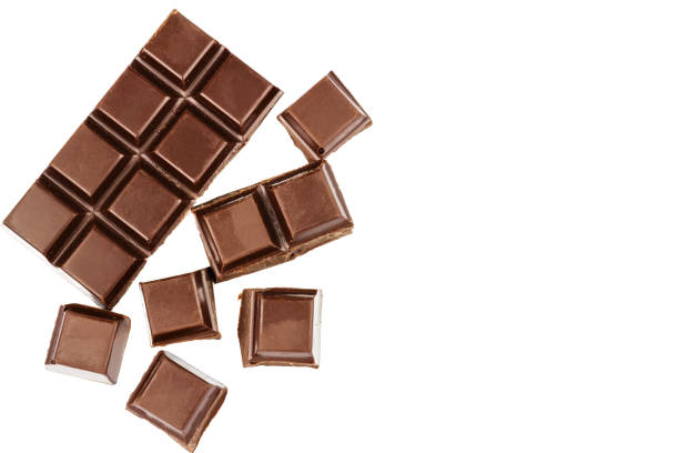 istock Dark chocolate bar and cubes isolated on white background, top view. 640928154