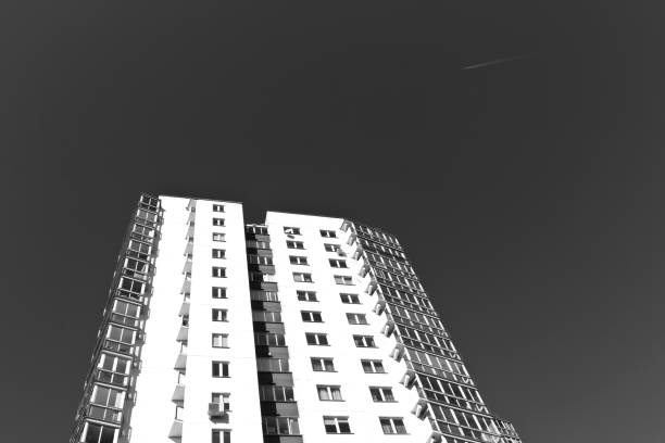 istock Modern residential building and plane trace in the sky 640928982