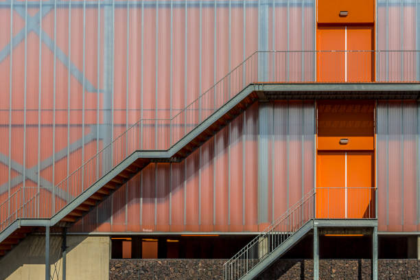 istock Modern colorful orange facade with exterior stairs of emergency exit 640930066