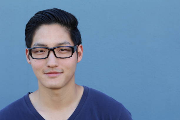 istock Attractive Asian man with glasses close up 640930774