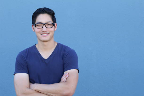 istock Asian man with glasses crossing his arms 640931056