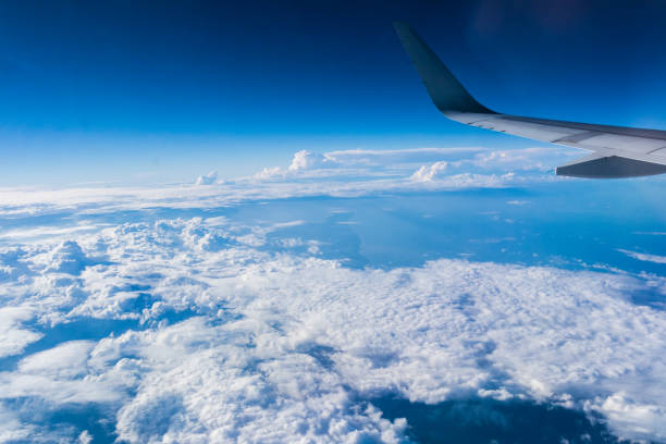 istock Light and shadows in the sky with clouds seen from an airplane. 640934944