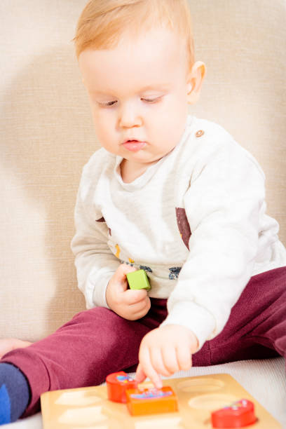 istock Baby boy playing with his father with colorful toy blocks 640936864