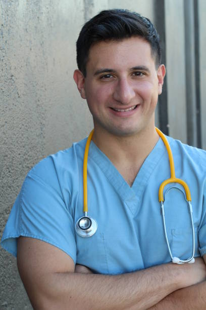 istock Handsome Smiling Doctor Isolated on Gray 640939510