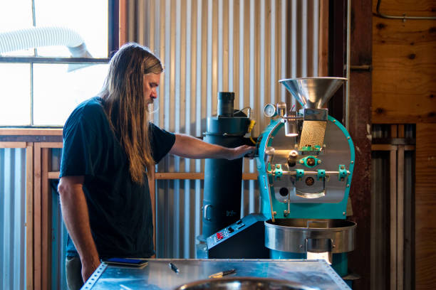 Coffee roaster in his factory