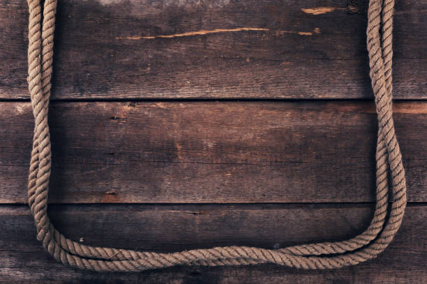 istock old rope on wood plank background 640942042