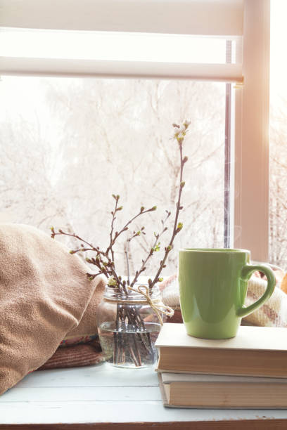 istock Cup of coffee on windowsill 640942216