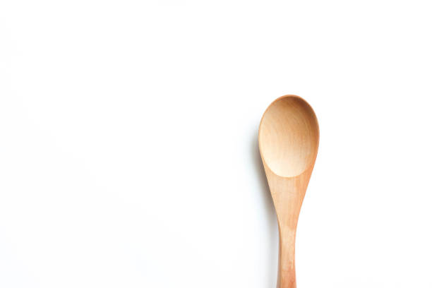istock wooden spoon on white background 640943444