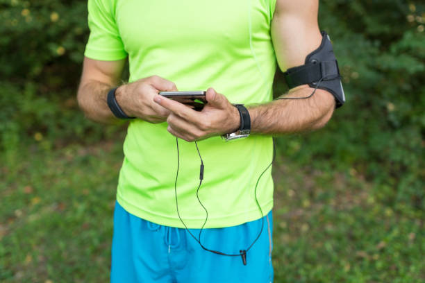 istock Male athlete adjusting his fitness tracker before a running session 640943892