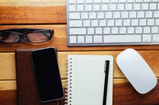 istock Office desk wood with computer, note book,phone concept in wood background.Copy space. 640945584