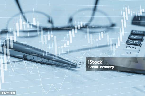 Stock Data Charts With Spreadsheet Calculator Pen And Glasses Concept Abstract Photo Of Stock Market Financial Bank Accounting Data Analysis And Monitoring Stock Photo - Download Image Now