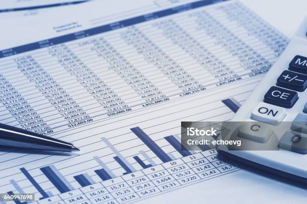 Accounting Financial Banking Banker Bank Stock Spreadsheet Data With Pen And Calculator In Blue Analysis Analyzer Calculations Stock Photo - Download Image Now