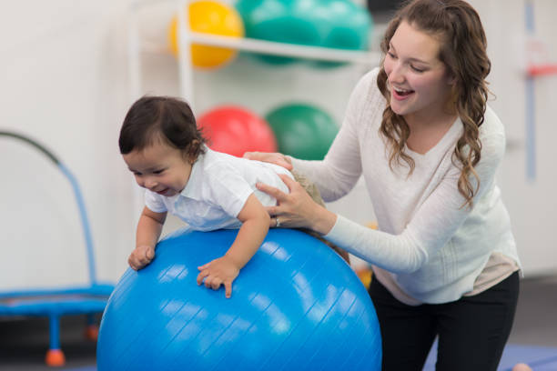 istock Exercising kids in physical therapy clinic 640947968