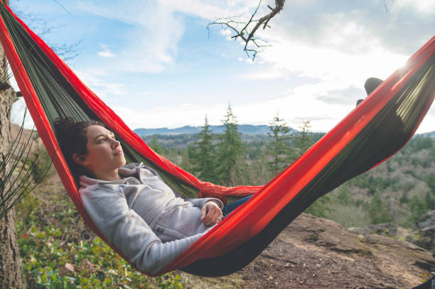 istock Young woman in hammock in forest 640948006