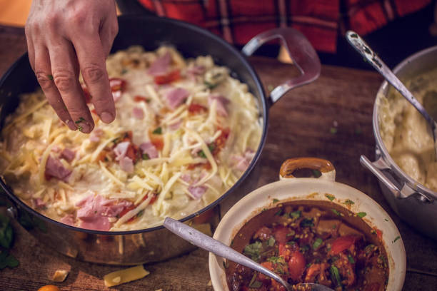 istock Preparing Baked Crepes Pancakes with Ham and Tomatoes 640948082