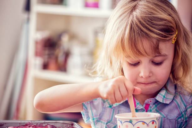 istock Eating Homemade Strawberry Ice Cream 640948826