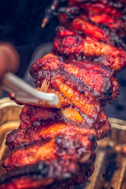 istock Spicy Chicken Wings on Spit Roast 640949038