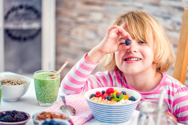 Eating Healthy Superfood Dishes Eating healthy superfood dishes like green chia smoothie with berries in a bowl, yoghurt with mango and nuts, short grained rice with yoghurt, honey, chia seeds. eating chia seeds stock pictures, royalty-free photos & images