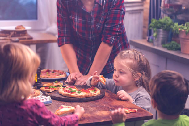 istock Eating Homemade Pizza at Home 640952154