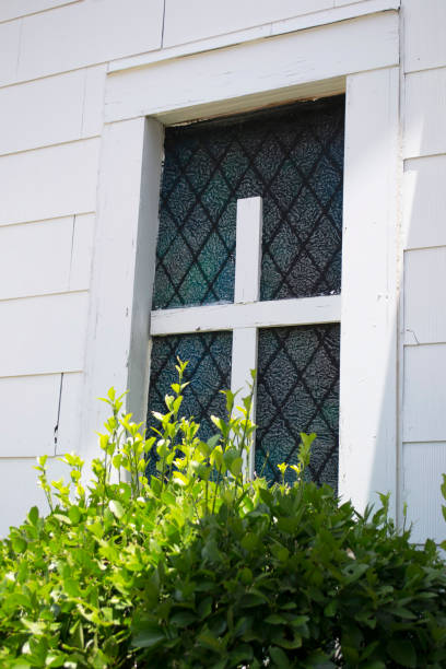 istock Window With Wooden White Cross Decoration 640952558