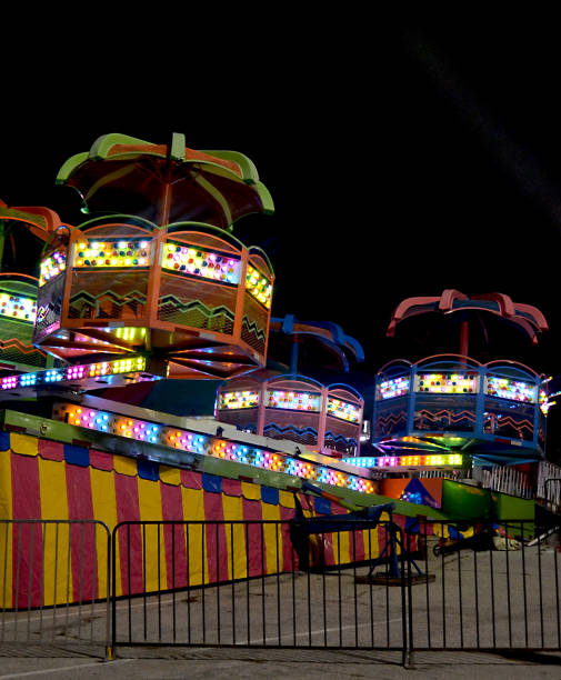 istock Colorful Lights On A Carnival Ride At Night 640952642