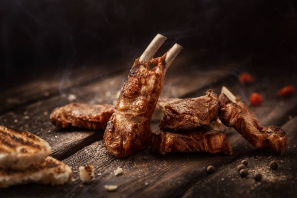 istock Grilled lamb chops on wooden table 640953340