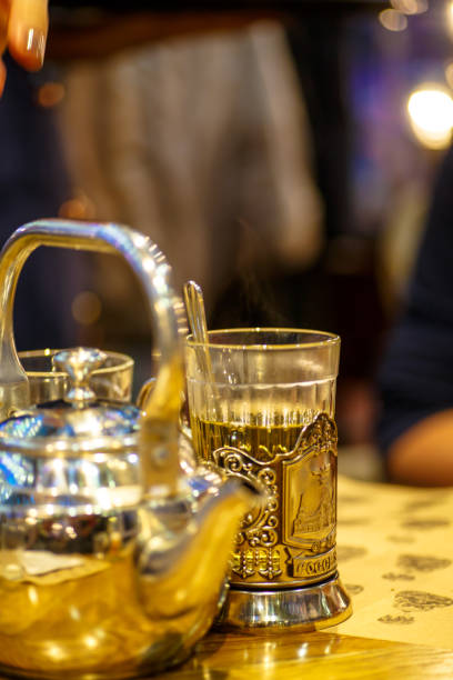 istock Shiny kettle for making tea and cup in the cup holder. 640957154