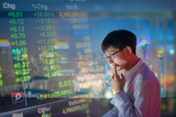 istock Businessman using a laptop on the rooftop of a skyscraper 640963832