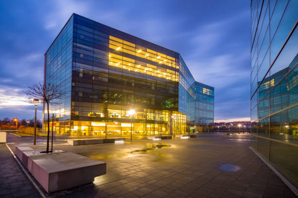 istock Office building with glass facade,Modern office building in the evening 640964844