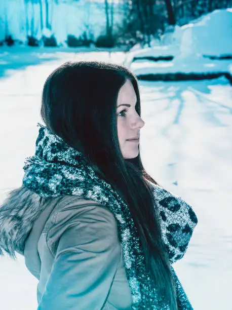 beautiful young woman portrait with scarf in winter