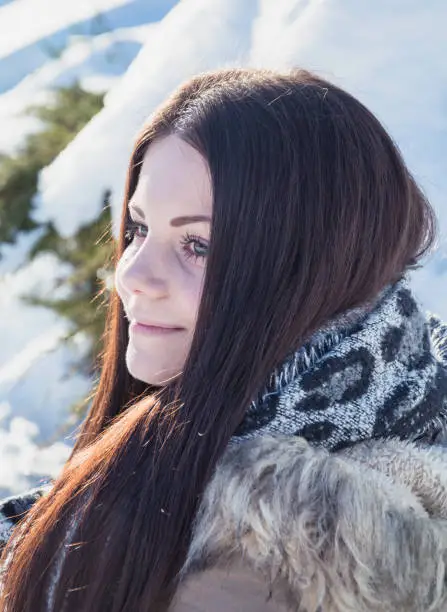 beautiful young woman portrait with scarf in winter