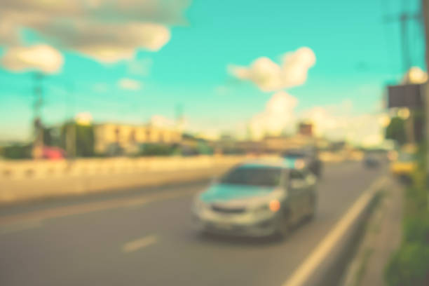istock blur car on road in evening time. 640966750