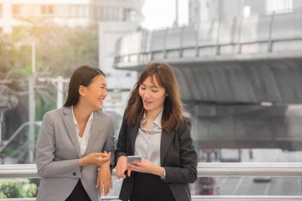 istock Two business people standing and talking about work outdoor. 640967380