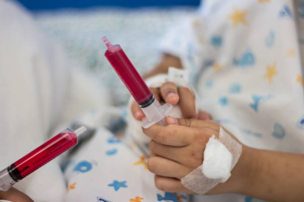 istock Children eat syrup medication in syringe 640967598