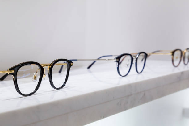 detail view of various eyeglasses lying on a tray