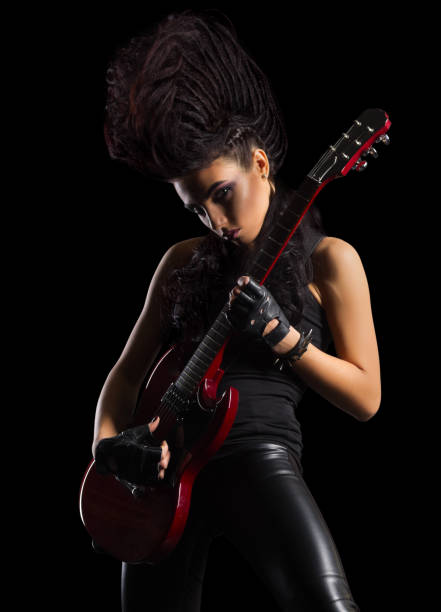 istock Young woman hard rock musician isolated 640967996