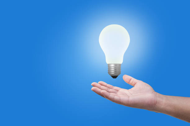 istock businessman giving light bulb ideas to coworker 640969614