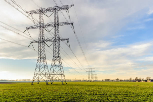 istock Row of power pylons in a rural Dutch landscape 640972714